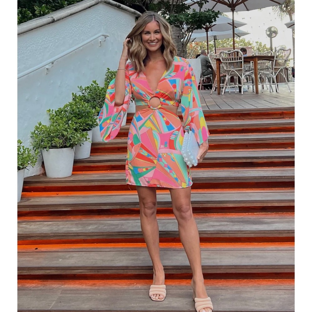 Mini multi color dress with cut out from and back.